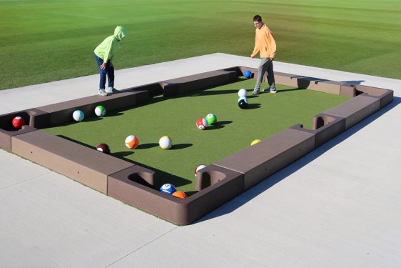 Kids playing Outdoor Concrete Games's Soccer Pool - Snookball with soccer balls